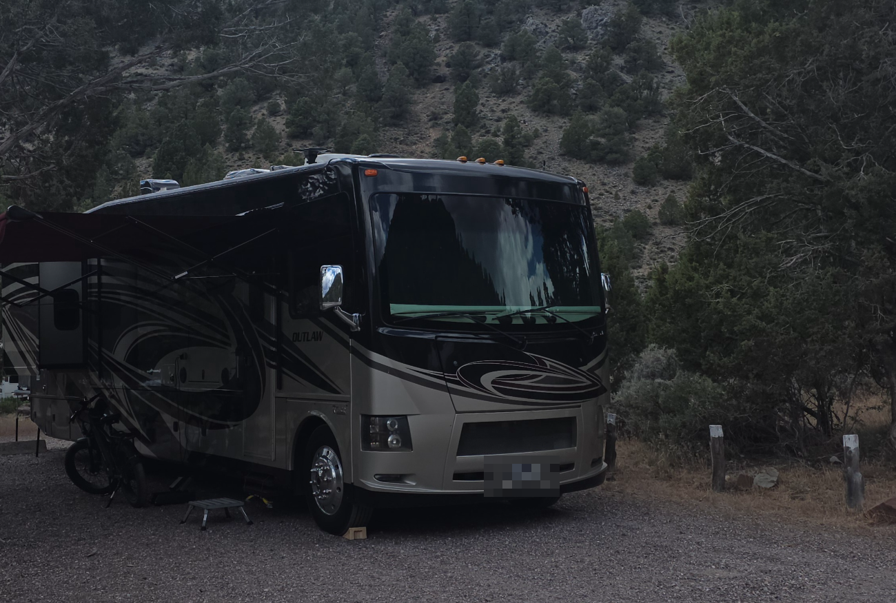Our Thor Outlaw Class A motorhome at a mountain campsite